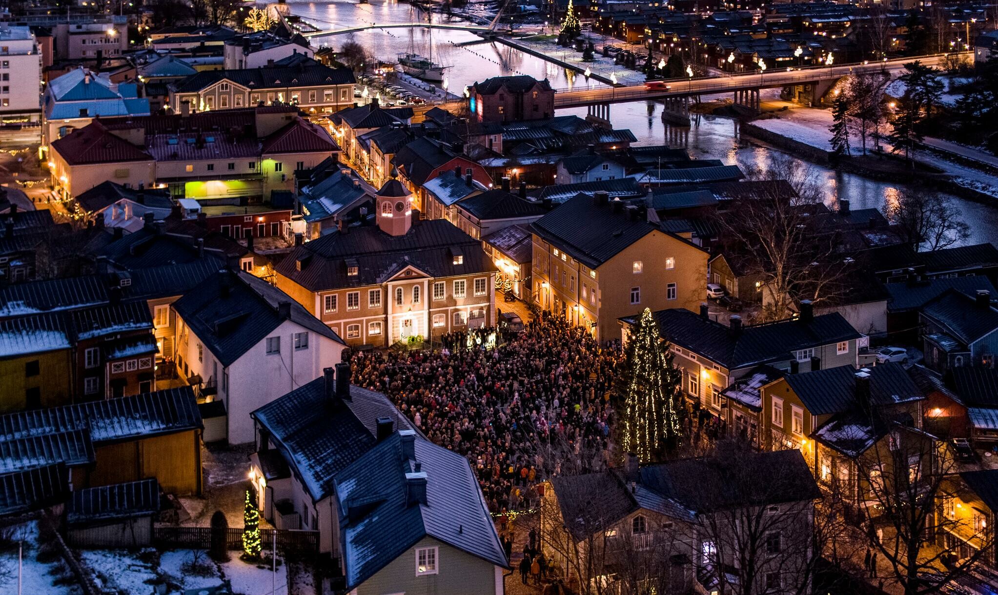 Image from above over Porvoo at Christmas season. People gathered in Old Porvoo for an event.